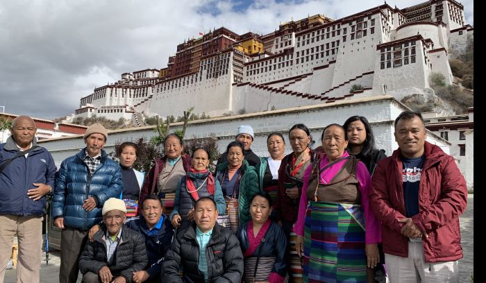 sherpa buddhist pilgrimage group at Potala Palace, Lhasa Tibet
